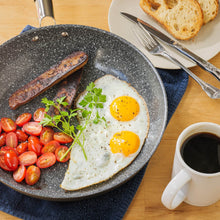 Fried eggs, sausage and cherry tomatoes cooked in the DaTerra Cucina 9.5-inch nonstick frying pan, served with coffee and toast